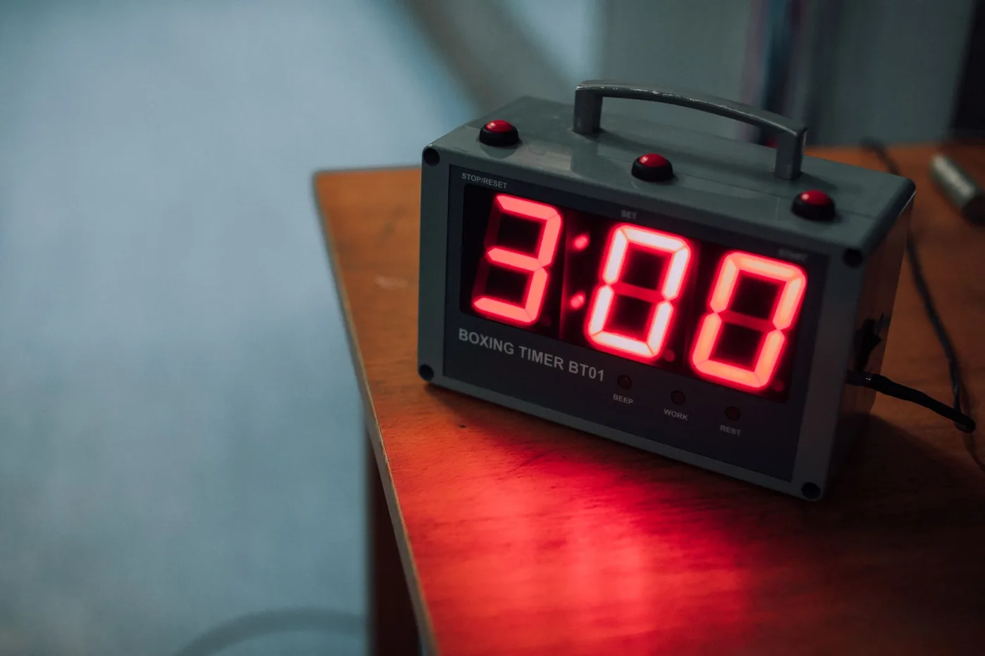 A stopwatch on a dark table top