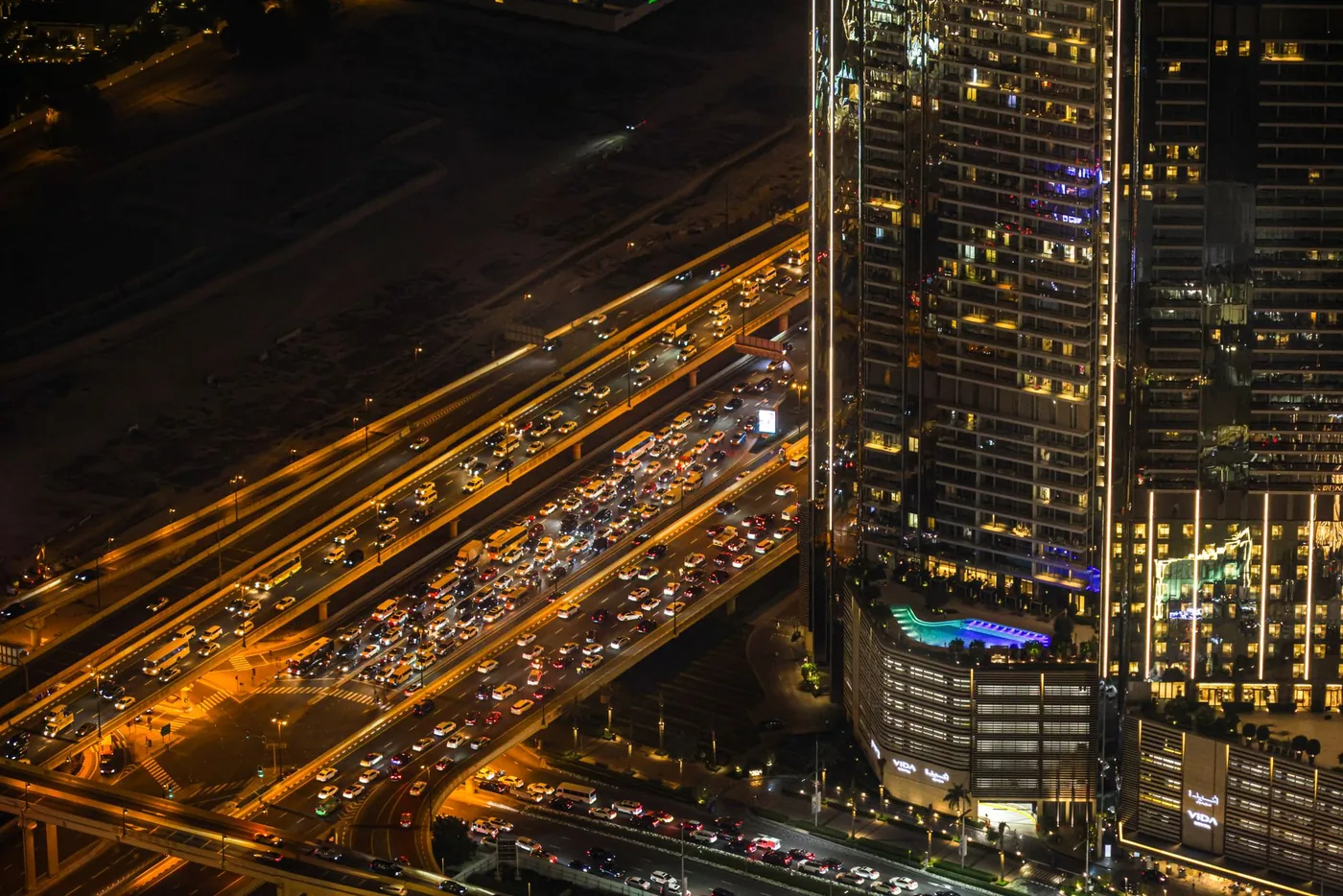 Dense evening traffic on a multi-lane urban highway seen from above