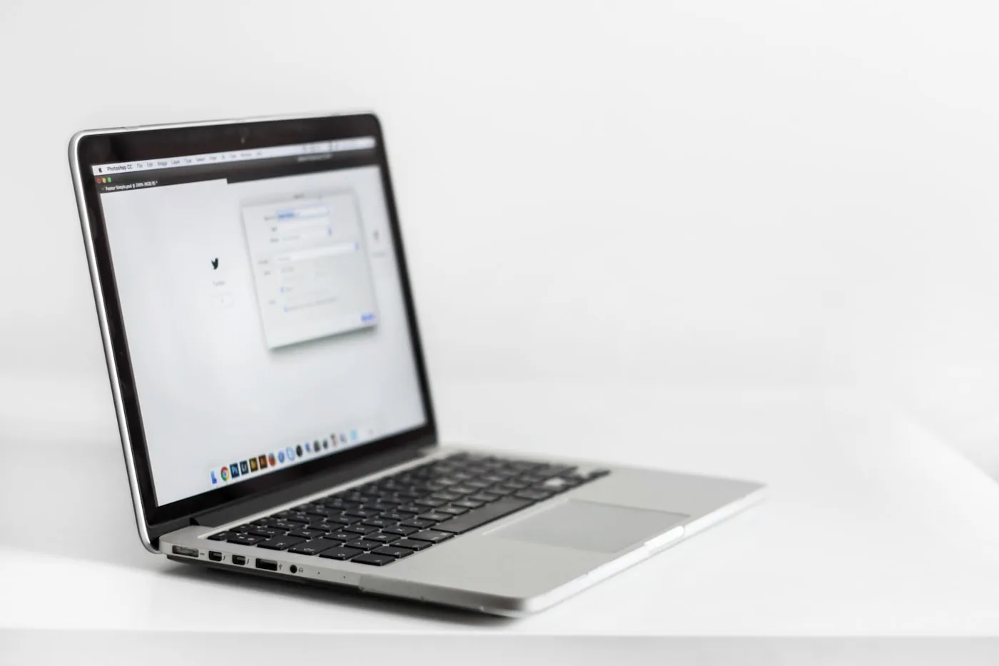 A laptop with a web app open on a white desk